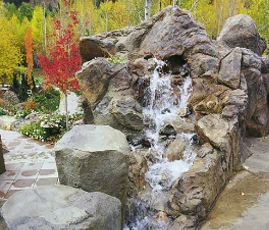 large waterfall feature in garden